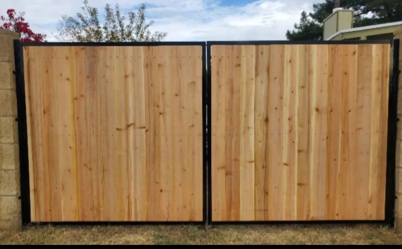 Cedar fence panels in a black steel frame